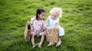 Two young childen with Retykle packaging