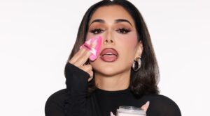 Huda Kattan shot with her products